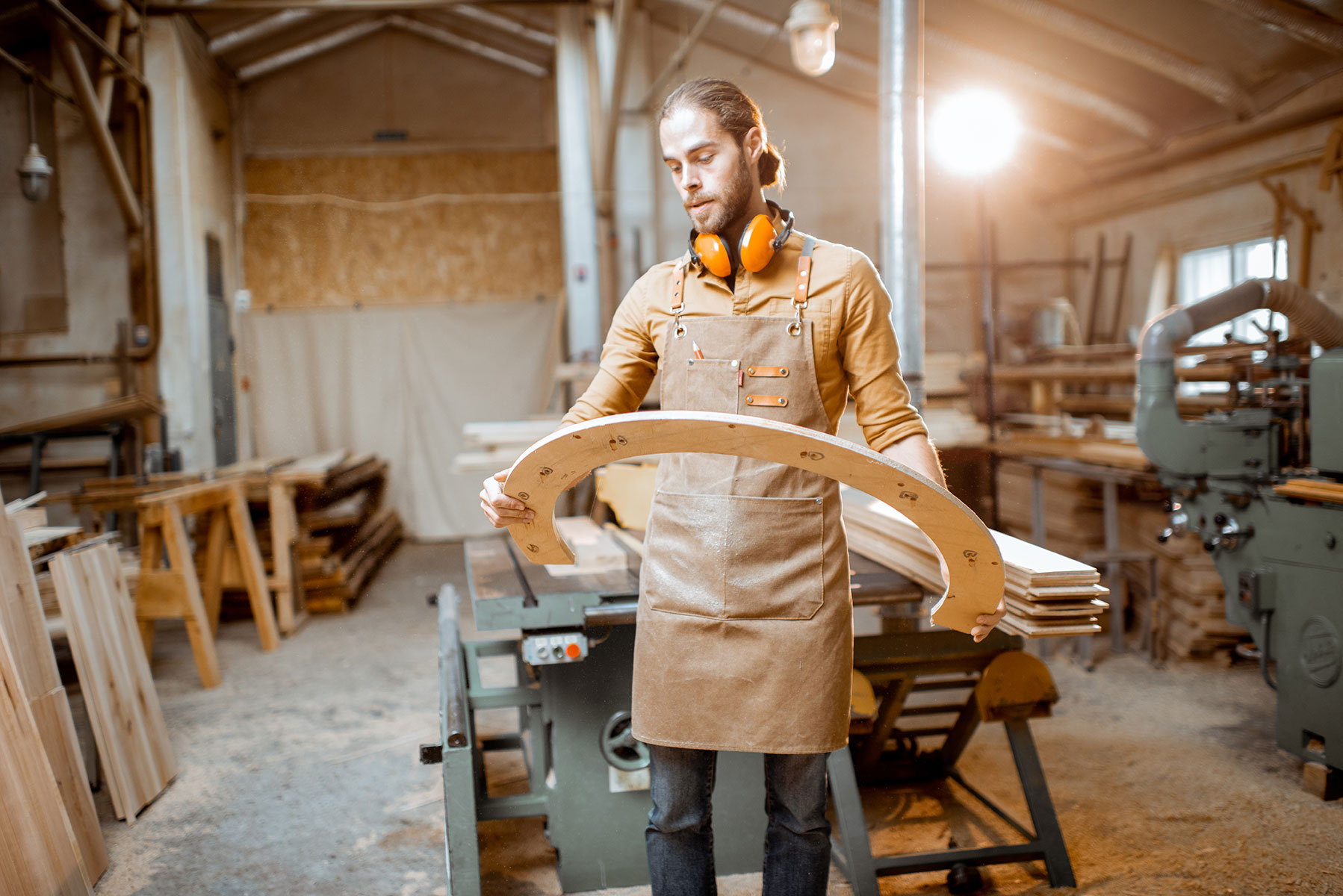 carpenter-with-some-wooden-part-at-the-workshop-2023-11-27-05-09-30-utc