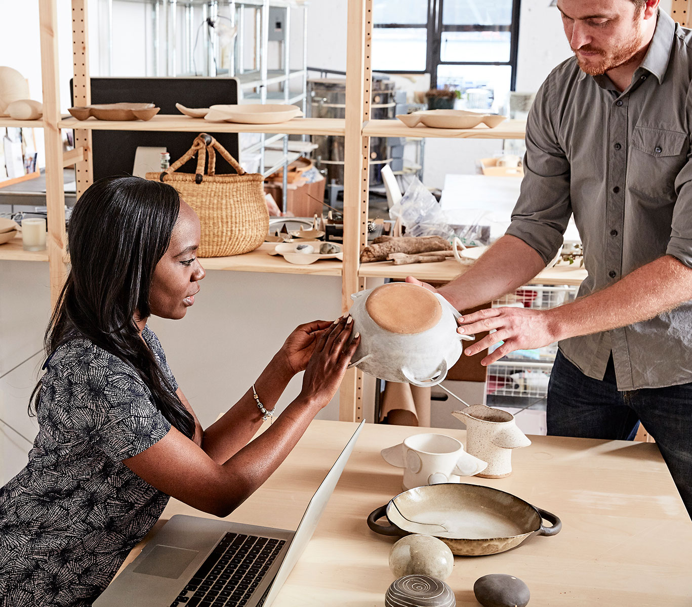 man-showing-colleague-ceramic-samples-2024-06-18-23-08-18-utc