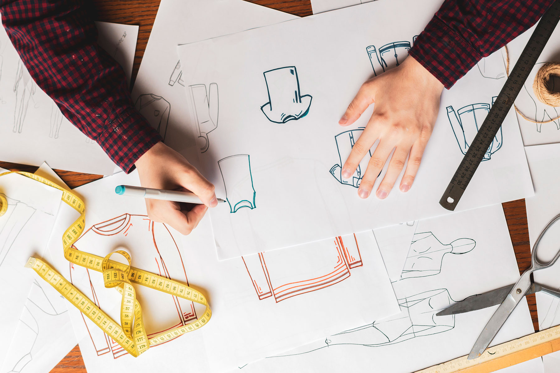overhead-top-view-designer-doing-clothes-sketch-b-2024-09-17-23-38-41-utc