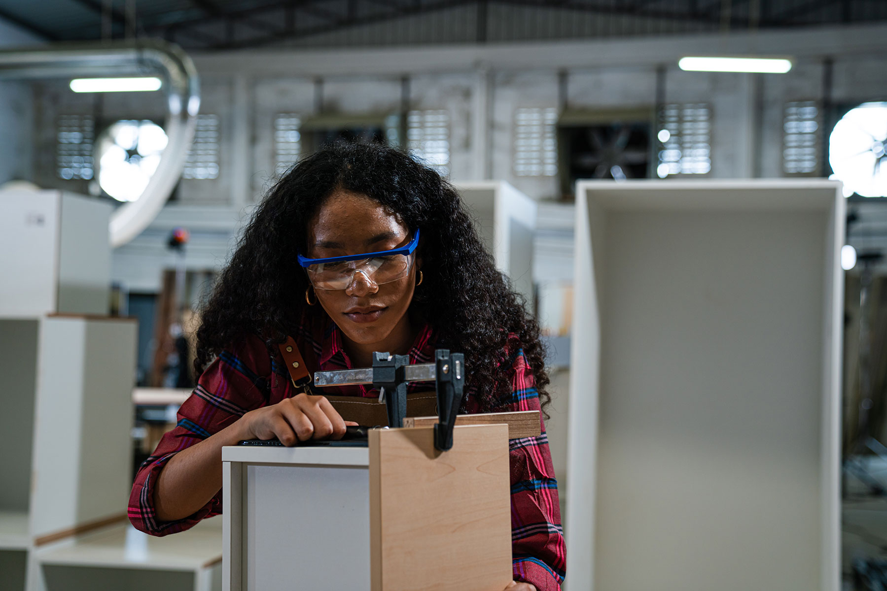 young-woman-working-as-carpenter-in-a-small-carpen-2024-08-22-01-56-34-utc